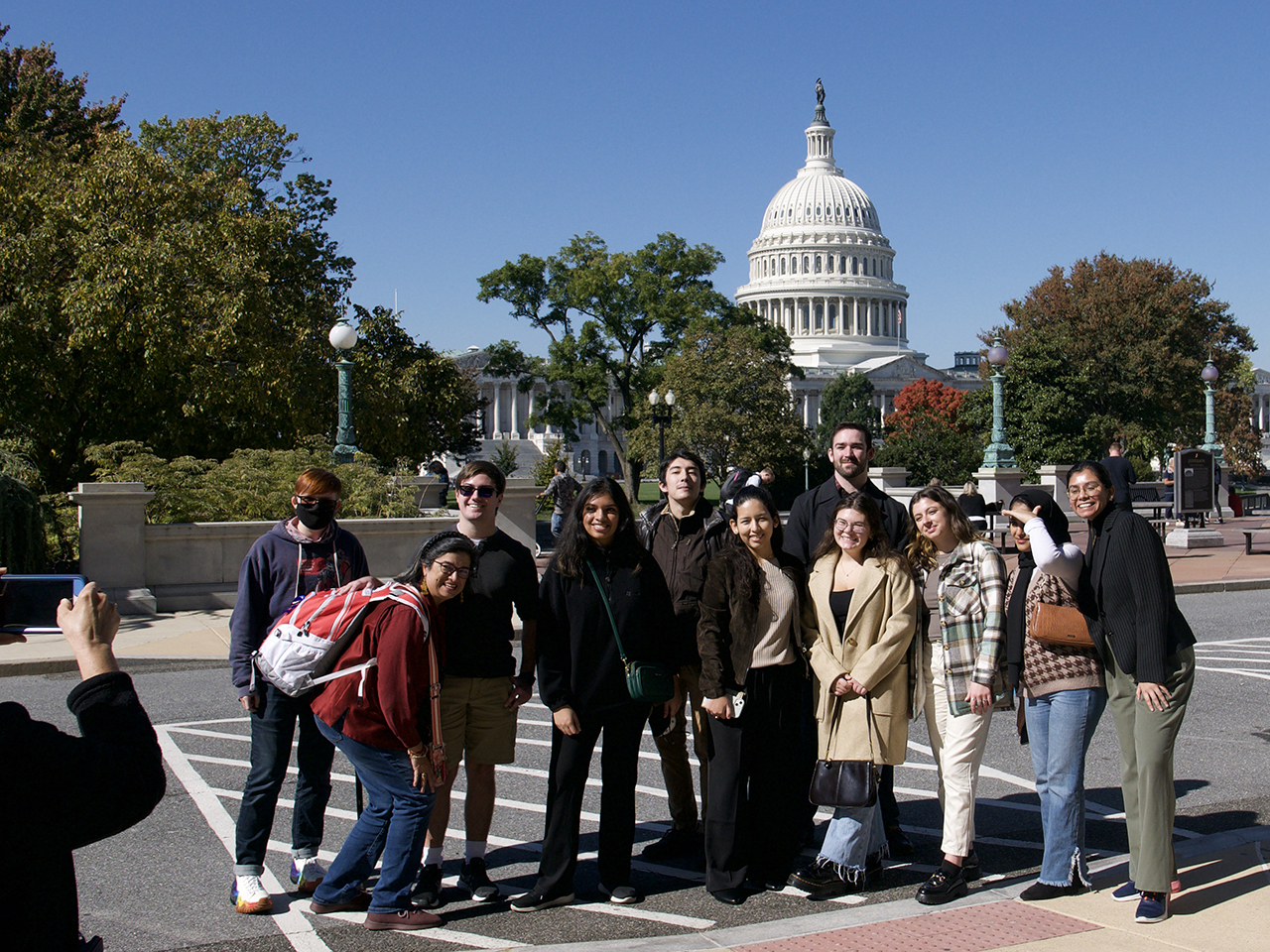 Students in the Pillars of Research Learning Community pose for a picture in front of the US Capitol during a field trip to the Library of Congress.